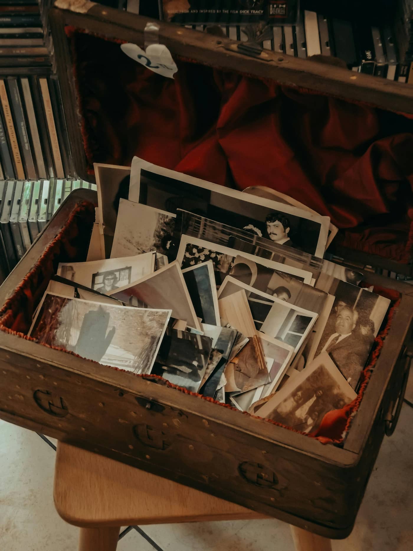 Old family photographs held in someone's hands